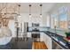 Stylish kitchen features white cabinets, stainless steel appliances, and granite countertops at 111 S Monroe St # B203, Denver, CO 80209