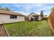 Large backyard with a patio, seating, grill, and detached garage with ample green space at 3464 S Downing St, Englewood, CO 80113