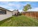 Expansive backyard features a patio area, large shade tree, and a well-maintained lawn at 3464 S Downing St, Englewood, CO 80113