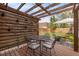 Backyard patio features a wooden pergola with outdoor furniture and string lights for evening relaxation at 3464 S Downing St, Englewood, CO 80113