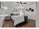 Cozy bedroom featuring a ceiling fan, hardwood floors, and a comfortable bed at 3464 S Downing St, Englewood, CO 80113