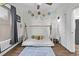 Charming bedroom with a unique bed frame, playful decor, soft lighting and hardwood floors with neutral walls at 3464 S Downing St, Englewood, CO 80113
