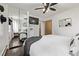 Bright bedroom featuring a ceiling fan, TV, mirror closet and a neutral color scheme, creating a calm and inviting atmosphere at 3464 S Downing St, Englewood, CO 80113