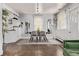 Dining room with hardwood floors, modern table setting, and plenty of natural light at 3464 S Downing St, Englewood, CO 80113