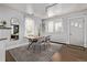 Dining room featuring a wood table, grey chairs, and a decorative rug on hardwood floors at 3464 S Downing St, Englewood, CO 80113