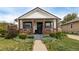 Charming single story home featuring a cozy front porch and meticulously landscaped front yard at 3464 S Downing St, Englewood, CO 80113