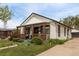 Inviting single story home showcasing a covered front porch and well-maintained lawn at 3464 S Downing St, Englewood, CO 80113
