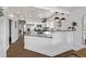 Bright kitchen with white cabinets, granite countertops, and stainless steel appliances at 3464 S Downing St, Englewood, CO 80113