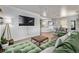 Open-concept living area flows seamlessly into dining, with hardwood floors and ample natural light at 3464 S Downing St, Englewood, CO 80113