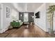 The living room offers hardwood floors, a green sofa and modern decor at 3464 S Downing St, Englewood, CO 80113