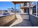 View from covered front porch of a modern townhome, showing neighborhood street view at 6240 N Dayton Ct, Denver, CO 80238