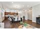 Bright dining room flows into the kitchen, complemented by hardwood floors and recessed lighting at 6240 N Dayton Ct, Denver, CO 80238