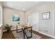 Home office featuring a modern wood desk, neutral walls, and stylish decor at 6240 N Dayton Ct, Denver, CO 80238