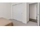 Carpeted bedroom featuring a closet with sliding doors at 5173 Vivian St, Wheat Ridge, CO 80033
