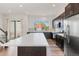Gourmet kitchen with stainless steel appliances, large island, and easy access to outdoor spaces at 5173 Vivian St, Wheat Ridge, CO 80033