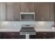 Stylish kitchen featuring stainless steel appliances, modern backsplash, and plenty of prep space at 5173 Vivian St, Wheat Ridge, CO 80033