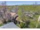 Aerial shot of a charming home with mature trees and mountain views at 306 E Cannon St, Lafayette, CO 80026