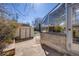 Backyard featuring a greenhouse, a storage shed, and a stone patio at 306 E Cannon St, Lafayette, CO 80026