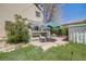 Exterior with patio, lush greenery, and an attached greenhouse at 306 E Cannon St, Lafayette, CO 80026
