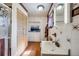 Bathroom featuring a shower, cabinet storage, unique flooring, and natural light at 306 E Cannon St, Lafayette, CO 80026