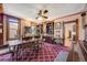 Traditional dining room featuring patterned wallpaper, a ceiling fan, and hardwood trim at 306 E Cannon St, Lafayette, CO 80026