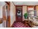 Classic entryway featuring a wood door, patterned wallpaper, and vintage details at 306 E Cannon St, Lafayette, CO 80026