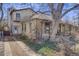 Charming home with a unique tower feature, complemented by a cozy porch, driveway and a fenced yard at 306 E Cannon St, Lafayette, CO 80026