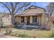 Quaint single-Gathering home with a charming covered porch and mature trees at 306 E Cannon St, Lafayette, CO 80026