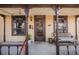 Welcoming front porch with decorative columns and a bench, perfect for relaxing outdoors at 306 E Cannon St, Lafayette, CO 80026
