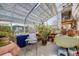 Sunroom filled with potted plants and natural light, perfect for gardening enthusiasts at 306 E Cannon St, Lafayette, CO 80026