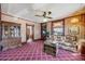 Inviting living room with vintage furniture, detailed trim, and a traditional cabinet at 306 E Cannon St, Lafayette, CO 80026