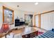 Cozy living room featuring hardwood floors, large windows, and a glass door at 306 E Cannon St, Lafayette, CO 80026