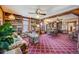 Spacious living room with built-in bookshelves and an adjacent dining area at 306 E Cannon St, Lafayette, CO 80026