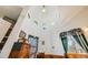 Spacious main bedroom featuring a cathedral ceiling and unique glass windows at 306 E Cannon St, Lafayette, CO 80026