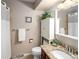Neutral bathroom featuring granite countertops, modern sink fixtures, and stylish decor at 12662 W Asbury Pl, Lakewood, CO 80228