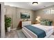 Bedroom featuring a bed with stylish pillows and a dresser with decor at 12662 W Asbury Pl, Lakewood, CO 80228