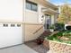 Attractive home with a garage, landscaped front yard, and covered front porch at 12662 W Asbury Pl, Lakewood, CO 80228