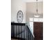 A beautifully designed foyer featuring a decorative front door with a staircase and an eye-catching light fixture at 12662 W Asbury Pl, Lakewood, CO 80228