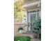 Inviting entryway with brick accents, decorative security door and landscaped garden at 12662 W Asbury Pl, Lakewood, CO 80228