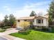 Well-maintained home with manicured lawn and mature trees at 12662 W Asbury Pl, Lakewood, CO 80228