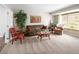 Comfortable living room with large windows, plush seating, area rug, and a bright, welcoming atmosphere at 12662 W Asbury Pl, Lakewood, CO 80228