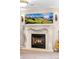 Charming living room featuring a decorative fireplace with a cozy atmosphere at 12662 W Asbury Pl, Lakewood, CO 80228