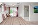 Serene primary bedroom with carpet floors, ensuite bath, patio access, and natural light at 12662 W Asbury Pl, Lakewood, CO 80228