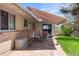 Back patio area with patio furniture, an awning, and a small garden at 12662 W Asbury Pl, Lakewood, CO 80228