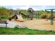 Community playground with slides, swings, and climbing structures at 12662 W Asbury Pl, Lakewood, CO 80228