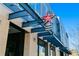 Tacos, Tequila, Whiskey with modern architecture highlighted by a striking red star and outdoor lighting at 2945 Grove St, Denver, CO 80211