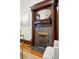 Detailed shot of a fireplace featuring a decorative mantel, columns, and a reflective mirror, adding elegance to the living space at 2945 Grove St, Denver, CO 80211