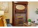 Close-up of a decorative fireplace with an ornate wood mantel, mirror, and classic design, enhancing the room's character at 2945 Grove St, Denver, CO 80211