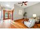 Inviting living room with hardwood floors, a ceiling fan, and French doors leading to the outdoors at 2945 Grove St, Denver, CO 80211