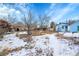 Spacious backyard partially covered in snow at 7111 Monaco St, Commerce City, CO 80022